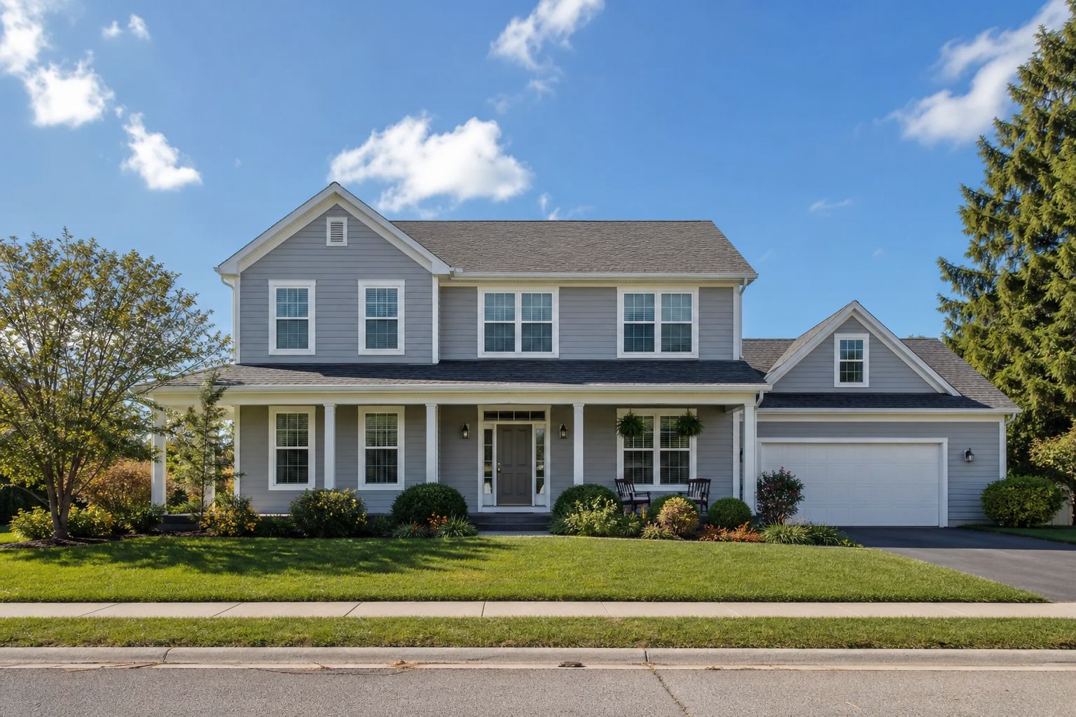 Suburban American home with new white-framed replacement windows